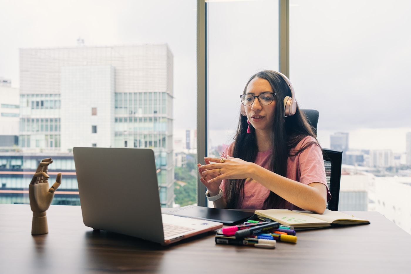 A professional participating in a remote video meeting